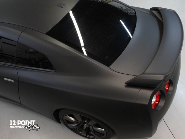 A view from above, showing the custom matte black wrap on the Nissan GT-R. 12-Point SignWorks