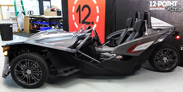 The completed Slingshot with custom vinyl graphics in our shop. 12-Point SignWorks