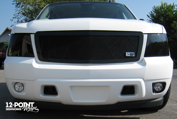 Custom matte white wrap on a Tahoe installed by 12-Point SignWorks in Franklin, TN.